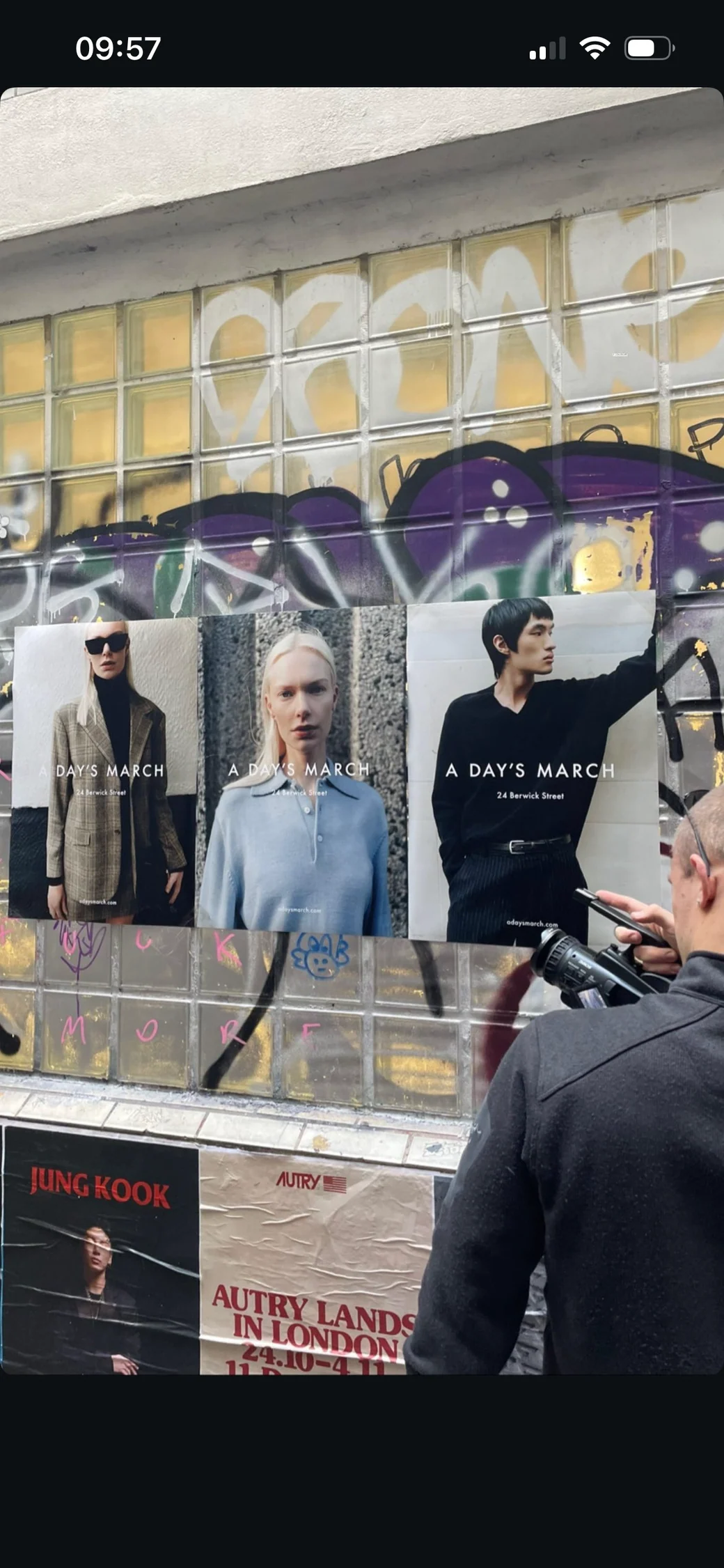 Instagram Story showing an A Days March shop window display and people on the pavement.