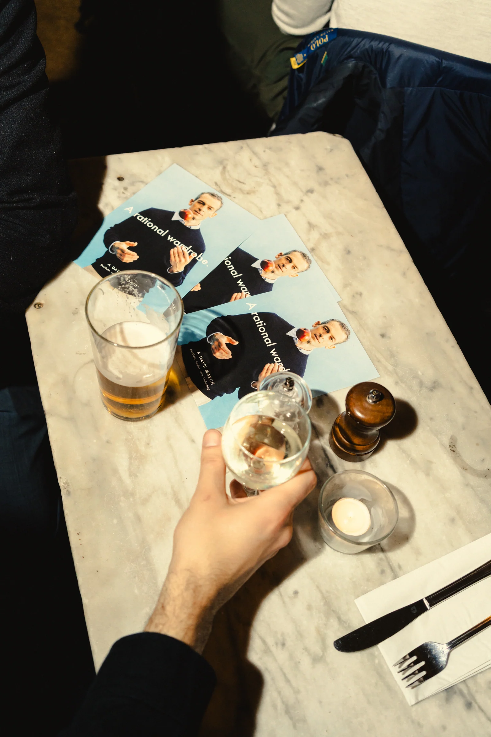 Drinks and printed campaign material on a pub table