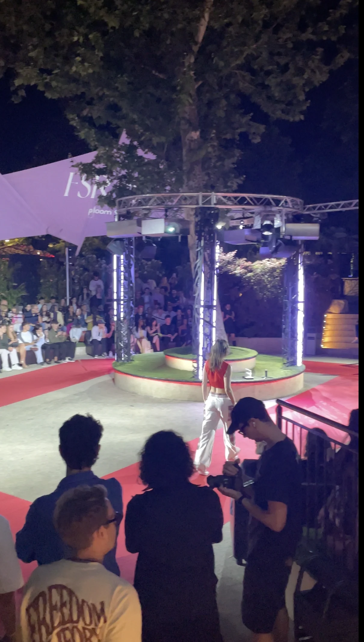 Audience facing the runway at the evening fashion show