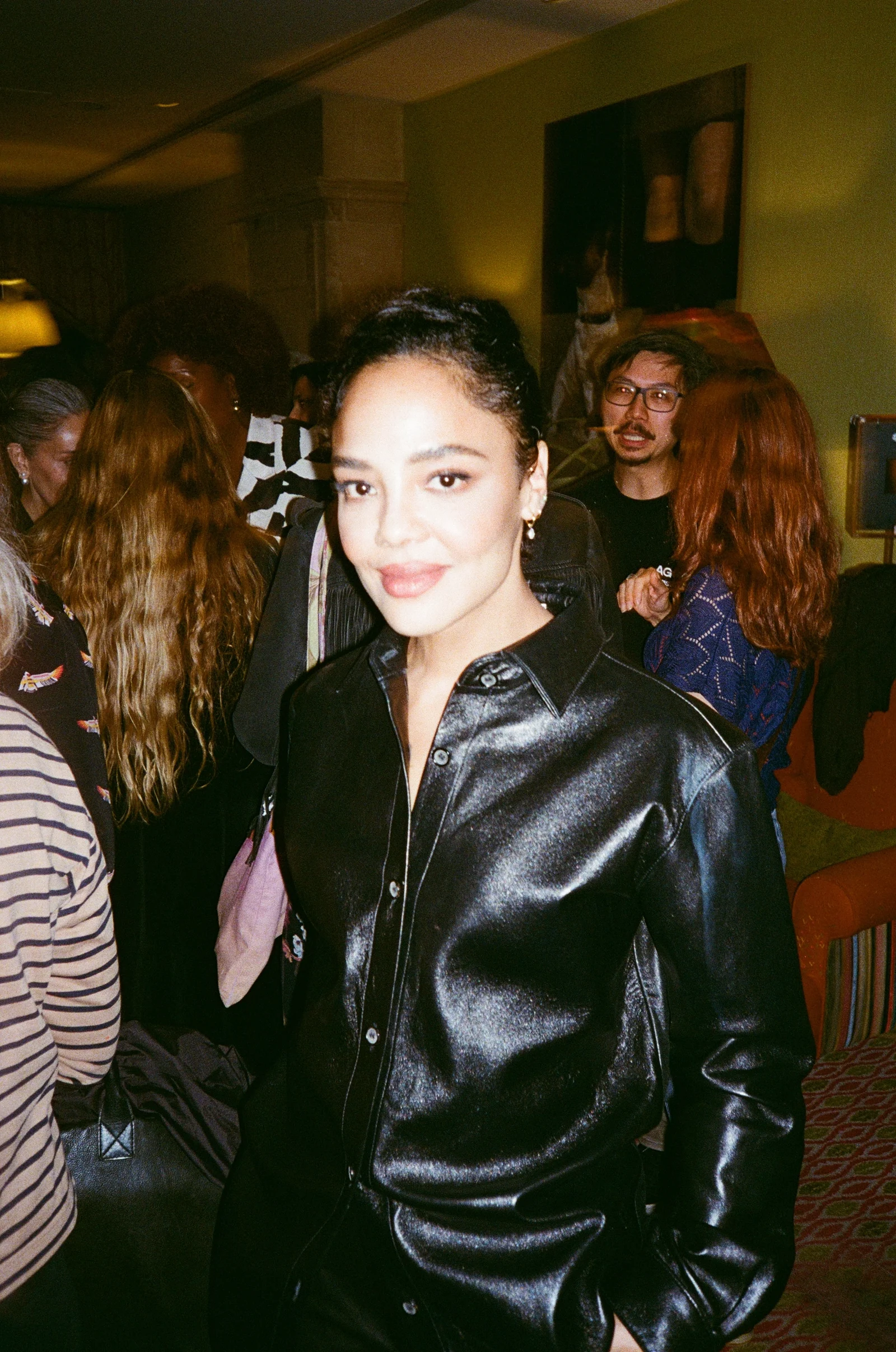 Guest wearing a black leather jacket at a festival reception