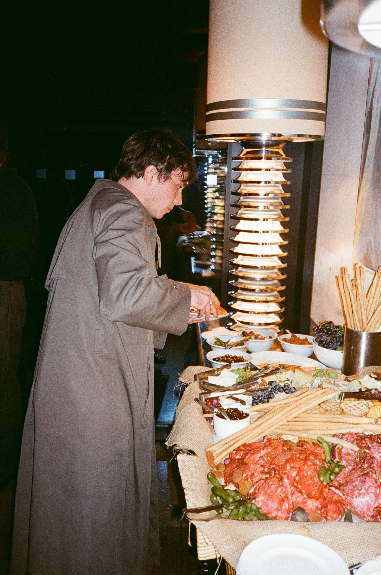 Guest selecting food from the reception buffet